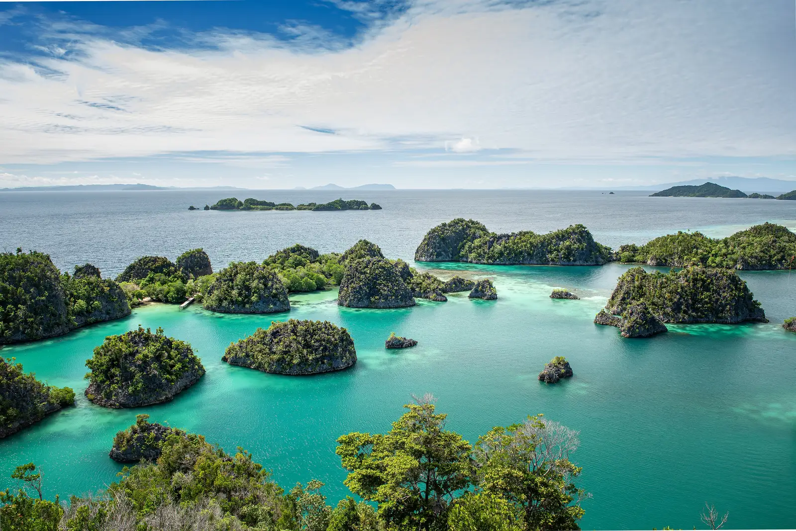 Wide aerial over the Piaynemo island cluster and its shallow channels